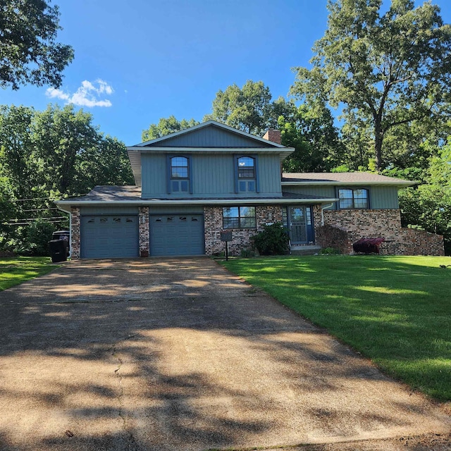 110 Emerald Ln, Horseshoe Bend, AR 72512 - split level home featuring a chimney, asphalt driveway, a front yard, an attached garage, and stone siding