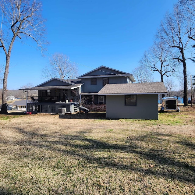 110 Emerald Ln, Horseshoe Bend, AR 72512 - back of property with a lawn, cooling unit, and a shingled roof