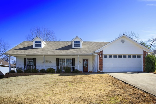 2118 Cedar Rdg, Benton, AR 72015 - view of front of home with driveway, a garage, covered porch, a front lawn, and a shingled roof