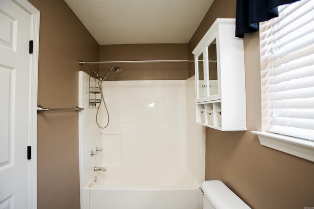 2118 Cedar Rdg, Benton, AR 72015 - full bathroom with  shower combination, toilet, and a textured ceiling