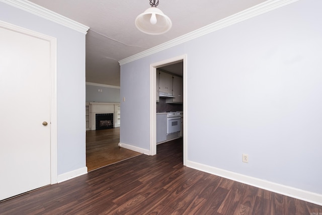 220 N Monroe St, Little Rock, AR 72205 - empty room with dark wood finished floors, ornamental molding, baseboards, and a fireplace