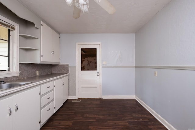 220 N Monroe St, Little Rock, AR 72205 - kitchen with open shelves, white cabinetry, ceiling fan, dark wood-type flooring, and a sink