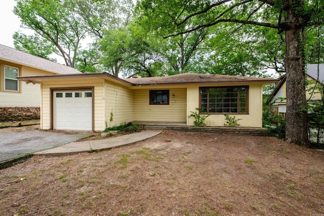 220 N Monroe St, Little Rock, AR 72205 - view of front facade featuring an attached garage and asphalt driveway