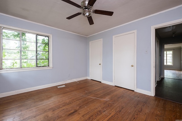 220 N Monroe St, Little Rock, AR 72205 - unfurnished bedroom featuring wood finished floors, baseboards, ornamental molding, and a ceiling fan