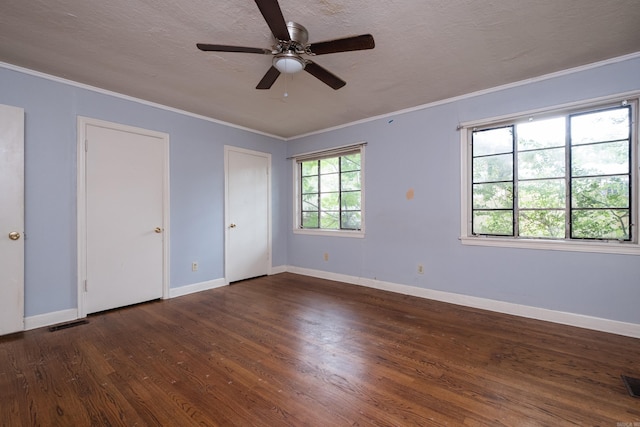 220 N Monroe St, Little Rock, AR 72205 - unfurnished bedroom featuring wood finished floors, baseboards, ornamental molding, multiple closets, and a ceiling fan
