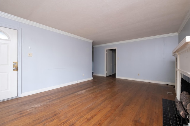220 N Monroe St, Little Rock, AR 72205 - unfurnished living room featuring a fireplace with flush hearth, wood finished floors, baseboards, and crown molding