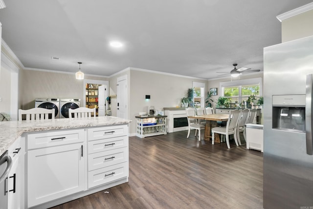 3101 Lax St, Newport, AR 72112 - kitchen featuring stainless steel refrigerator with ice dispenser, washing machine and dryer, dark wood-style flooring, a ceiling fan, and white cabinets