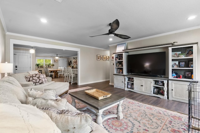 3101 Lax St, Newport, AR 72112 - living room featuring a ceiling fan, ornamental molding, wood finished floors, baseboards, and recessed lighting