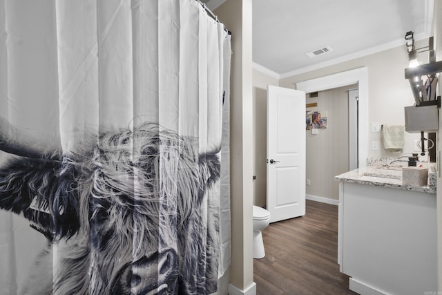 3101 Lax St, Newport, AR 72112 - bathroom featuring crown molding, toilet, vanity, wood finished floors, and baseboards