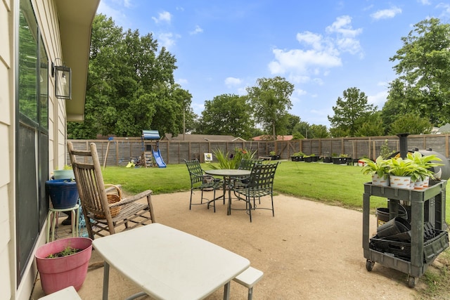 3101 Lax St, Newport, AR 72112 - view of patio featuring a playground and outdoor dining area