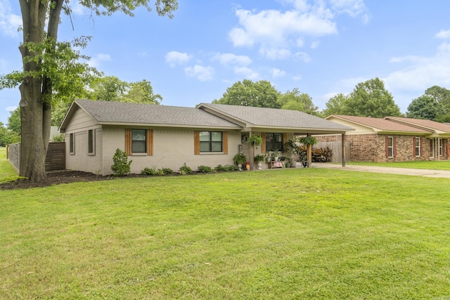 3101 Lax St, Newport, AR 72112 - ranch-style home with concrete driveway, brick siding, an attached carport, and a shingled roof