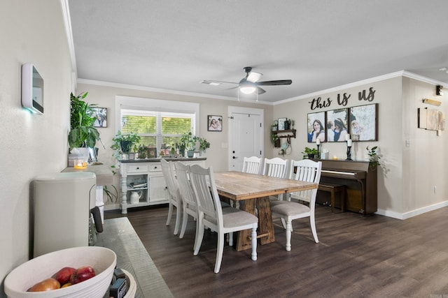 3101 Lax St, Newport, AR 72112 - dining room with dark wood-type flooring, a ceiling fan, crown molding, and baseboards
