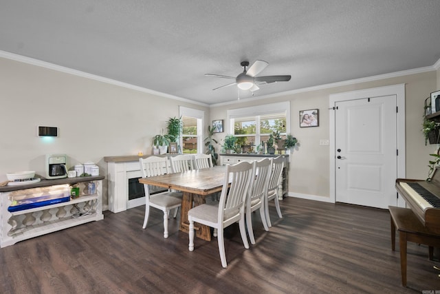 3101 Lax St, Newport, AR 72112 - dining space with dark wood finished floors, crown molding, ceiling fan, baseboards, and a textured ceiling