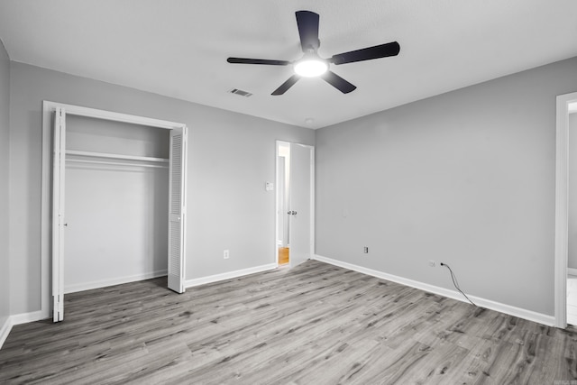 12224 Shawnee Forest Dr, Little Rock, AR 72212 - unfurnished bedroom featuring wood finished floors, a closet, baseboards, and a ceiling fan