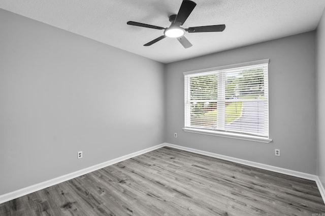 12224 Shawnee Forest Dr, Little Rock, AR 72212 - unfurnished room featuring wood finished floors, ceiling fan, baseboards, and a textured ceiling