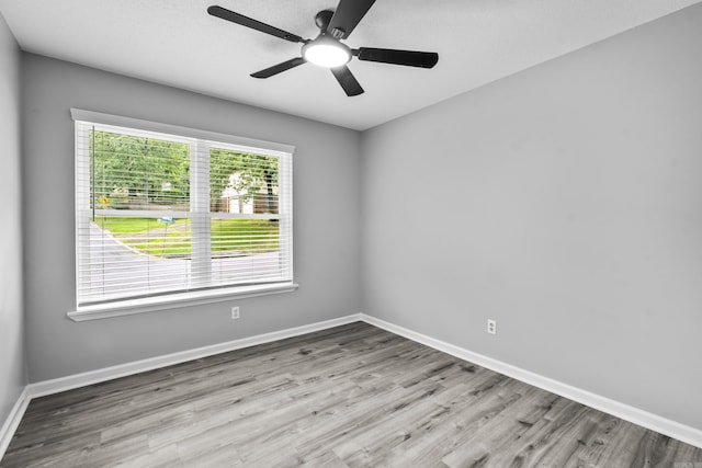 12224 Shawnee Forest Dr, Little Rock, AR 72212 - empty room featuring wood finished floors, baseboards, and a ceiling fan