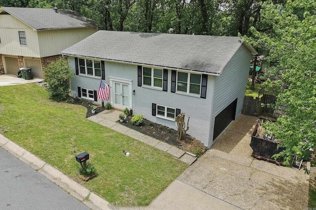 12224 Shawnee Forest Dr, Little Rock, AR 72212 - split foyer home featuring an attached garage, driveway, brick siding, and a shingled roof