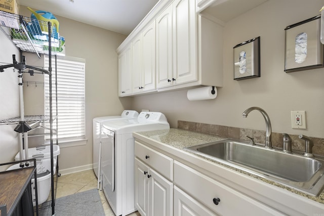 26 Jacob Pl, Little Rock, AR 72211 - laundry room with washing machine and dryer, cabinet space, light tile patterned floors, and baseboards