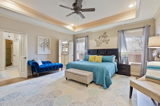 26 Jacob Pl, Little Rock, AR 72211 - bedroom with ornamental molding, a raised ceiling, connected bathroom, light wood-style floors, and baseboards