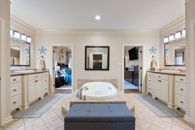 26 Jacob Pl, Little Rock, AR 72211 - bathroom with crown molding, ensuite bathroom, two vanities, tile patterned flooring, and a bath