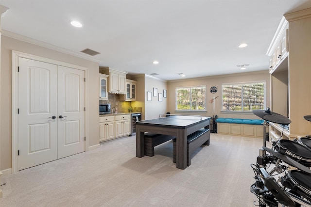 26 Jacob Pl, Little Rock, AR 72211 - game room with beverage cooler, crown molding, light colored carpet, and recessed lighting