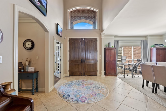 26 Jacob Pl, Little Rock, AR 72211 - entryway featuring arched walkways, a high ceiling, tile patterned flooring, and baseboards