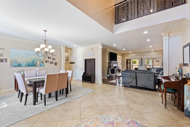 26 Jacob Pl, Little Rock, AR 72211 - dining room with light tile patterned floors, crown molding, ornate columns, a chandelier, and recessed lighting