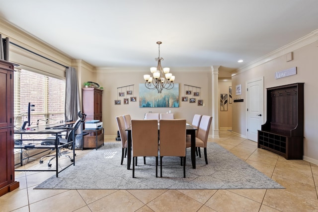 26 Jacob Pl, Little Rock, AR 72211 - dining space featuring crown molding, light tile patterned flooring, a chandelier, baseboards, and decorative columns