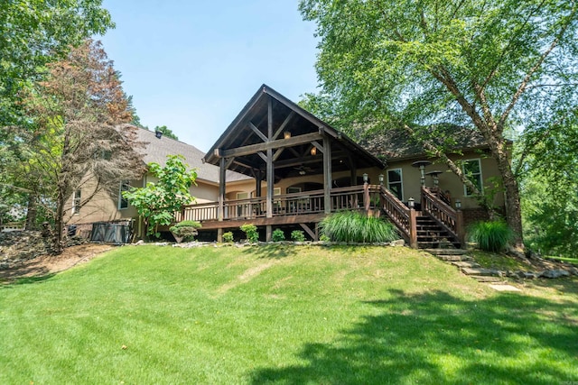 490 Quail Rdg, Hot Springs, AR 71901 - back of property featuring stucco siding, a deck, and a yard