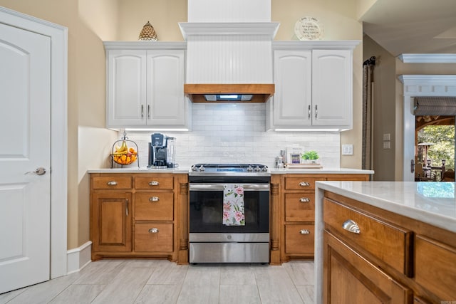 490 Quail Rdg, Hot Springs, AR 71901 - kitchen with stainless steel range, light countertops, decorative backsplash, and white cabinets