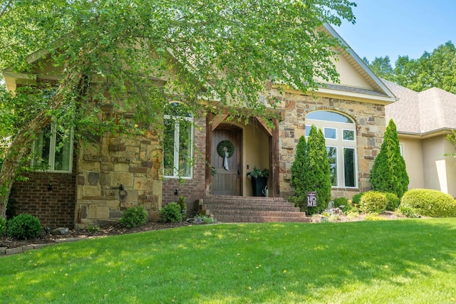 490 Quail Rdg, Hot Springs, AR 71901 - view of front of home with stucco siding, a front lawn, and stone siding