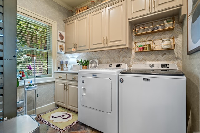 laundry area featuring cabinet space and separate washer and dryer