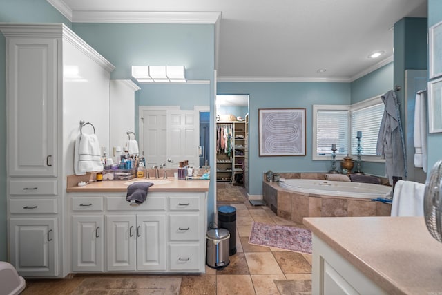full bath featuring vanity, a garden tub, and crown molding