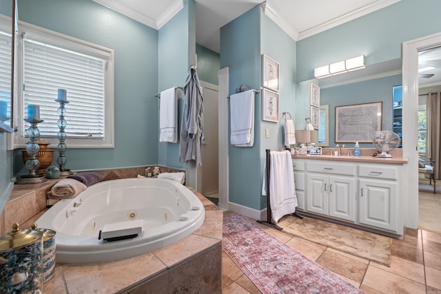 bathroom featuring crown molding, a tub with jets, and vanity