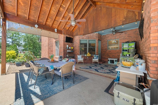 view of patio with outdoor dining space and a ceiling fan