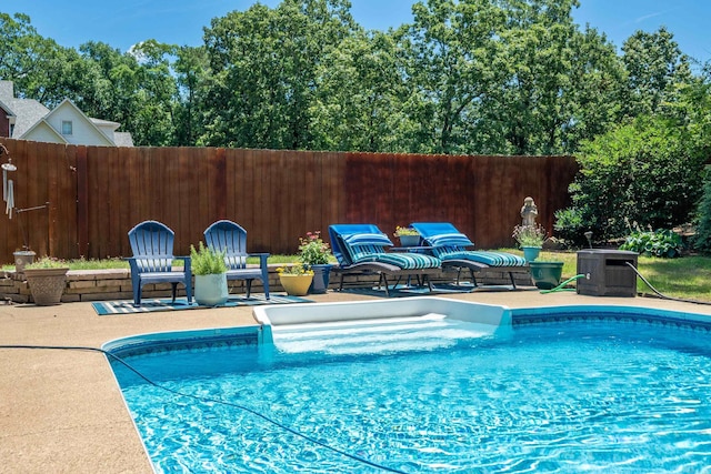 view of swimming pool featuring a patio