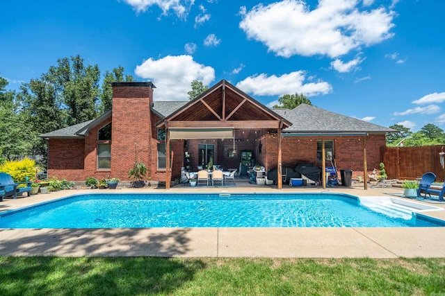 view of swimming pool featuring a patio area