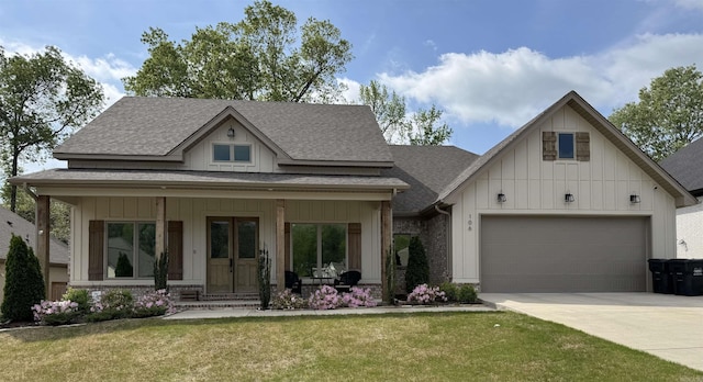 106 Harmony Village Dr, Haskell, AR 72015 - view of front of property featuring board and batten siding, a shingled roof, a garage, and a front yard