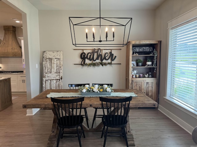 106 Harmony Village Dr, Haskell, AR 72015 - dining area with a chandelier, wood finished floors, and baseboards
