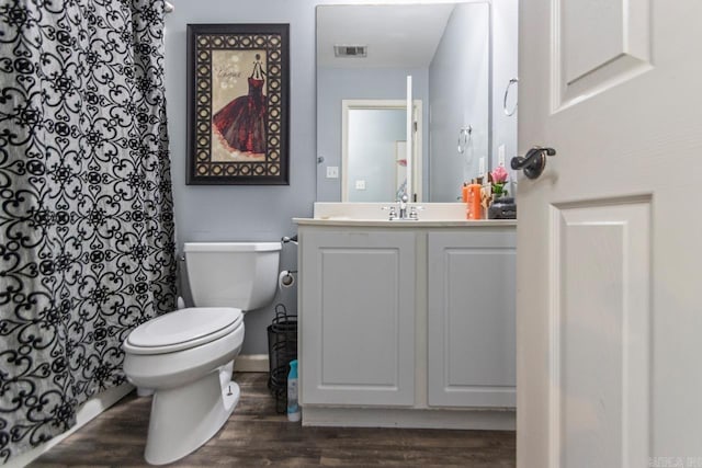 3023 Red Hawk Cv, Alexander, AR 72002 - full bath with wood finished floors, toilet, vanity, and curtained shower