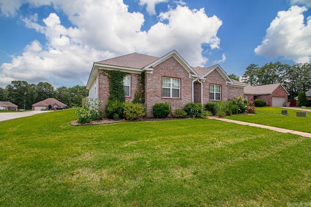 3023 Red Hawk Cv, Alexander, AR 72002 - single story home with brick siding, a front yard, and roof with shingles