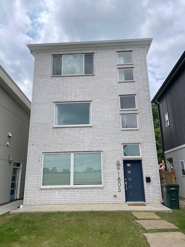 view of front of house featuring brick siding
