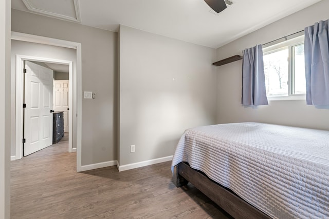 201 Sunset St, Hot Springs, AR 71913 - bedroom with wood finished floors, baseboards, and attic access