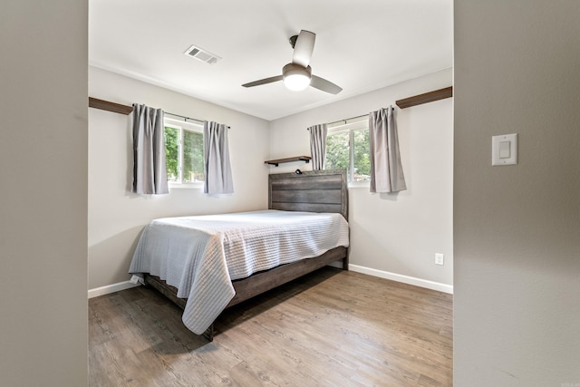 201 Sunset St, Hot Springs, AR 71913 - bedroom featuring multiple windows, baseboards, and wood finished floors