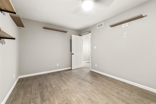 201 Sunset St, Hot Springs, AR 71913 - empty room with a ceiling fan, wood finished floors, and baseboards