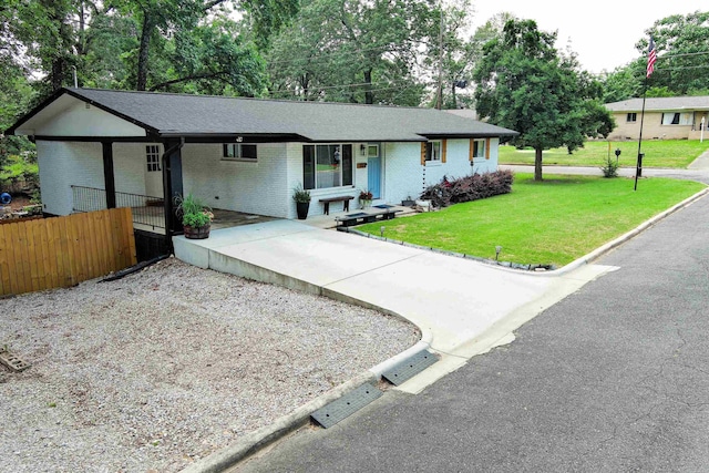 201 Sunset St, Hot Springs, AR 71913 - ranch-style home with concrete driveway, an attached carport, brick siding, and view of wooded area