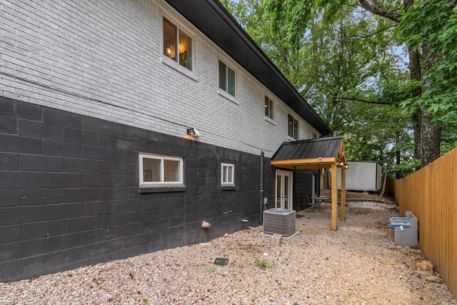 201 Sunset St, Hot Springs, AR 71913 - view of side of home featuring central air condition unit and brick siding