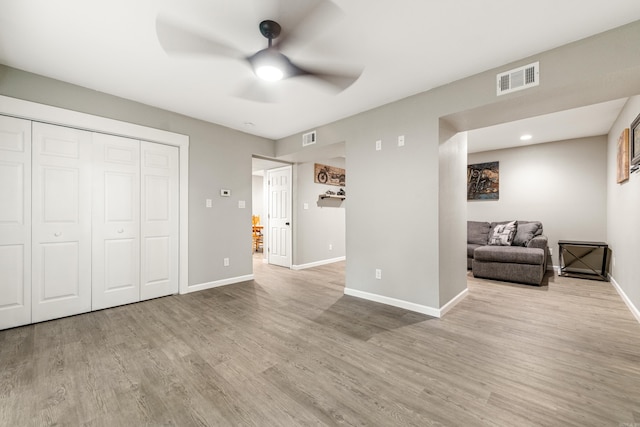 201 Sunset St, Hot Springs, AR 71913 - unfurnished living room with a ceiling fan, wood finished floors, and baseboards