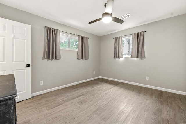 201 Sunset St, Hot Springs, AR 71913 - empty room featuring healthy amount of natural light, light wood-type flooring, and a ceiling fan