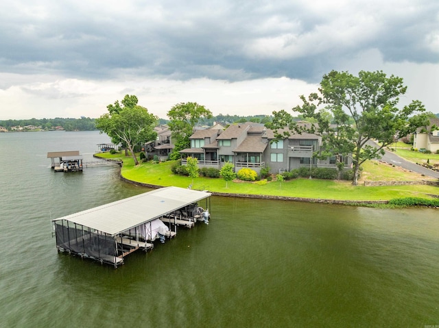 105 Long Island Bay Unit A1, Hot Springs, AR 71913 - dock featuring a water view, boat lift, and a lawn